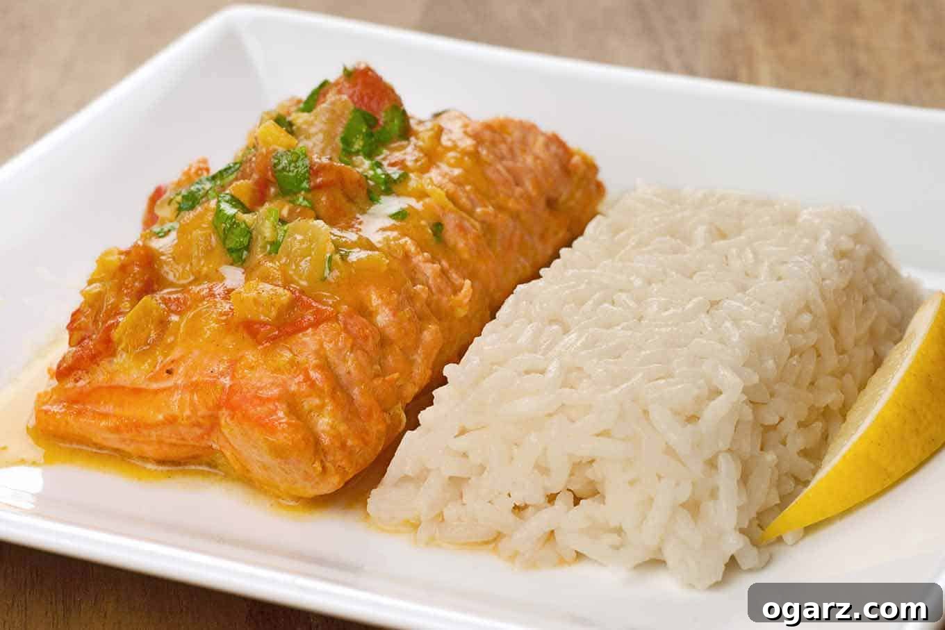 Vibrant Coconut Tomato Salmon Curry 2 Flavorful Salmon With Curried Coconut-Tomato Sauce served with basmati rice and fresh cilantro