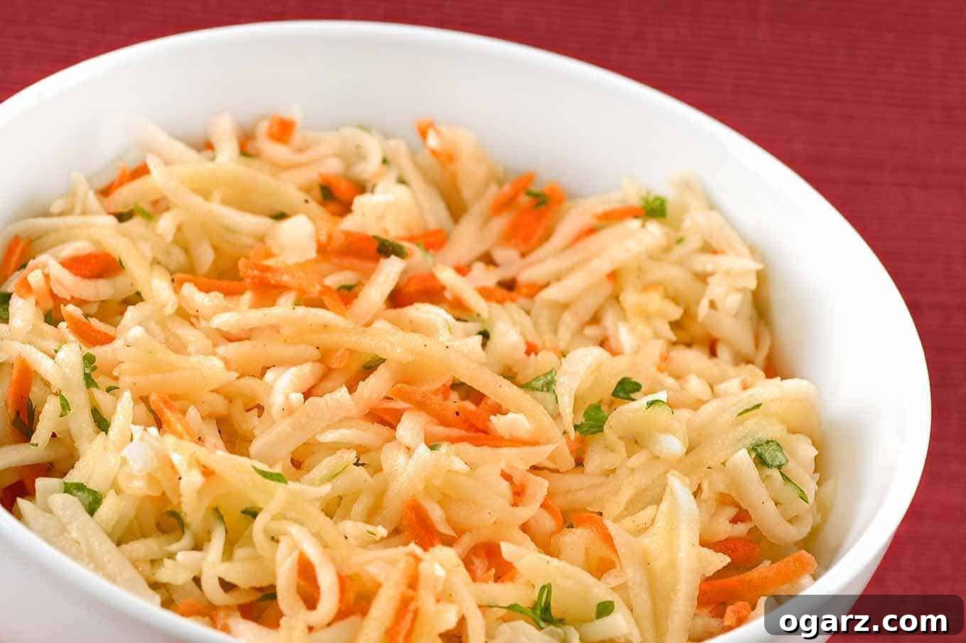 Turnip Apple Carrot Slaw 2 Vibrant Shredded Turnip, Apple, and Carrot Salad with fresh parsley garnish