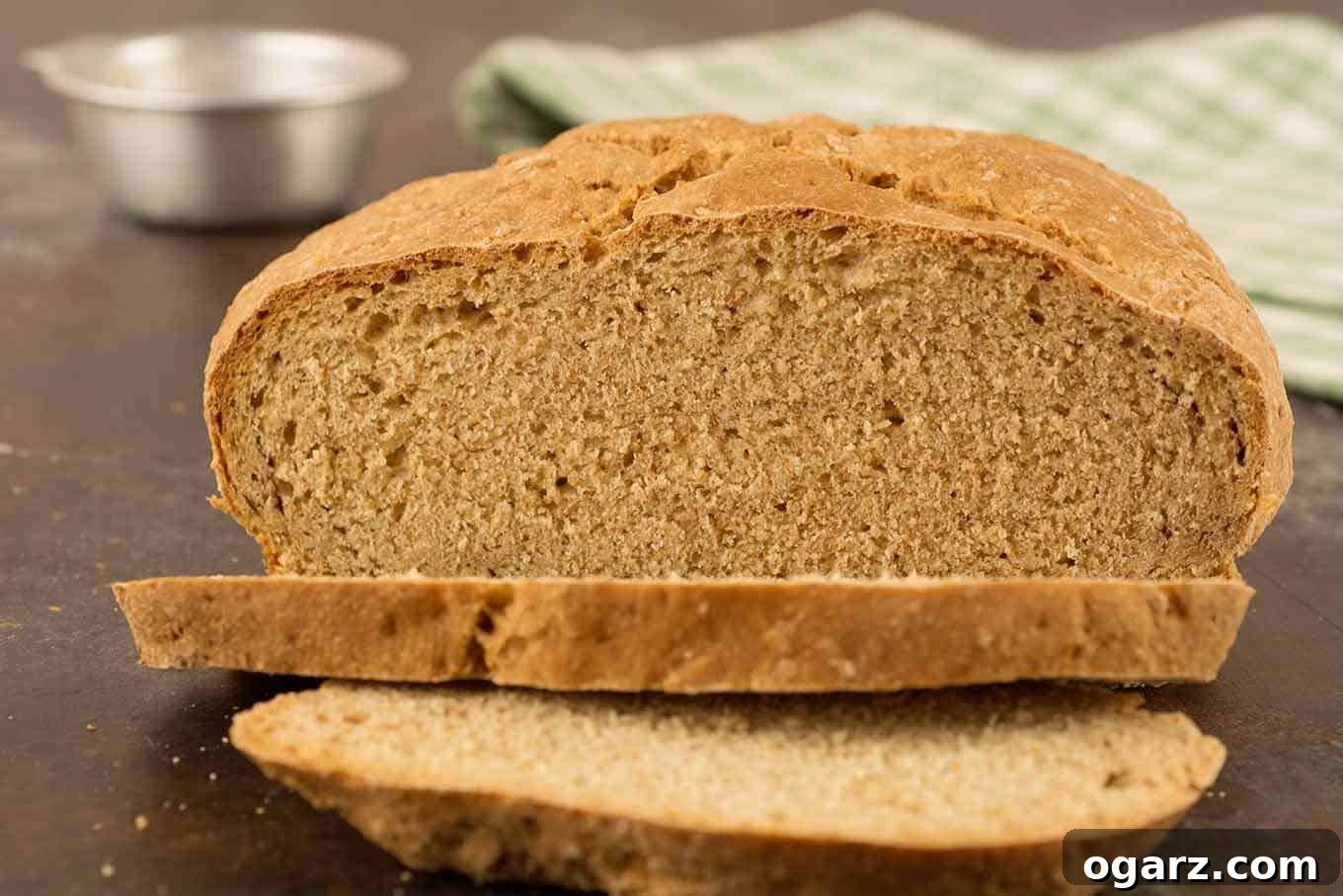 Effortless Homemade Irish Soda Bread 3 A round loaf of Irish soda bread, partially sliced to show the texture of the bread.