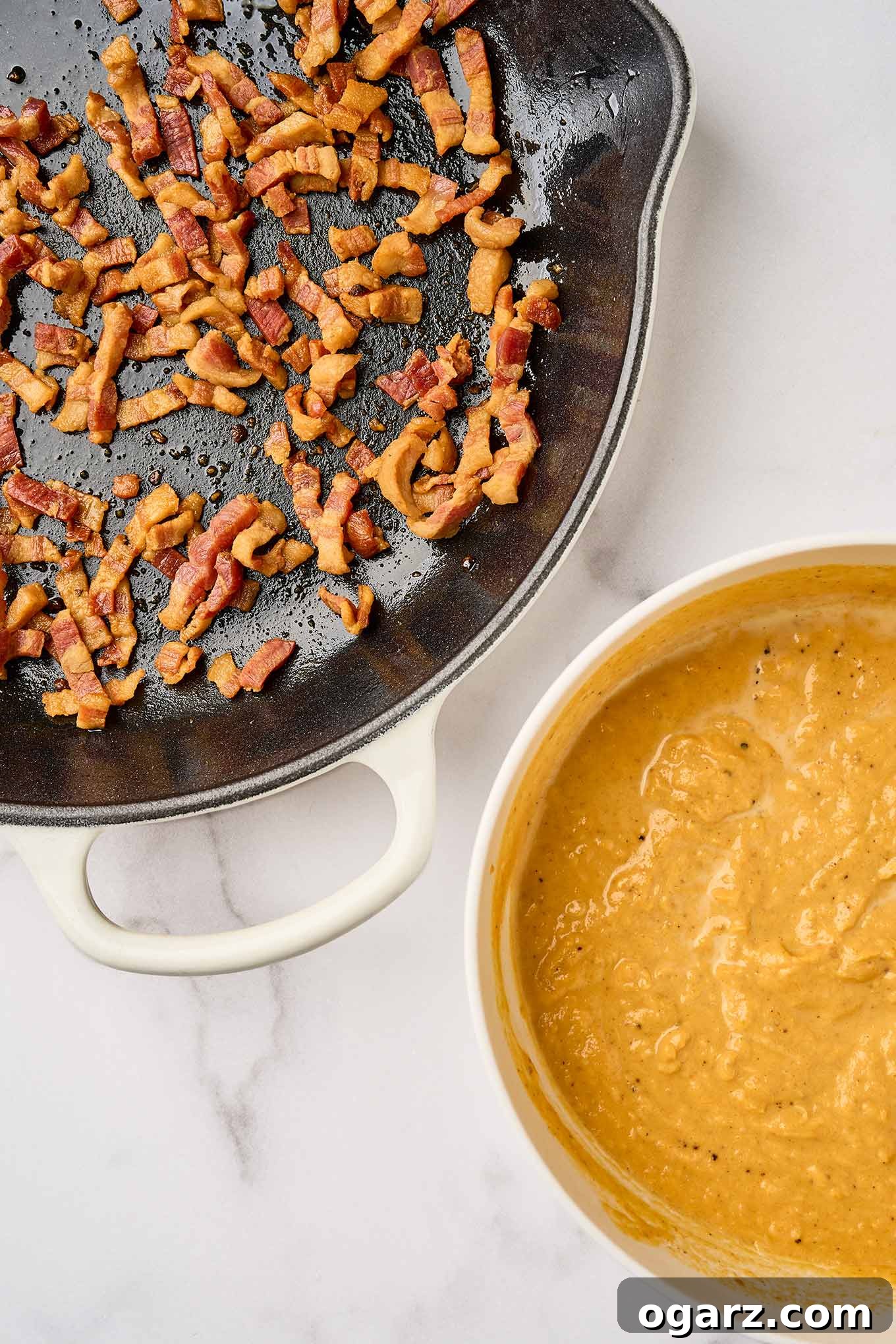 First steps in making creamy pumpkin pasta; crispy fried pancetta in a cast iron skillet, pumpkin puree, half-and-half, and nutmeg in a mixing bowl.