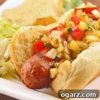 Close-up of Pineapple-Pepper Relish for hot dogs, showing diced pineapple, red bell pepper, and cilantro.