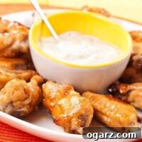 A closeup of the delicious tequila-marinated chicken wings with blue cheese dip.
