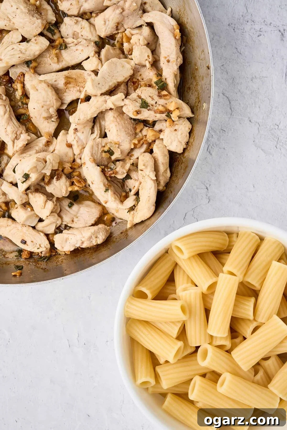 Nutty Brown Butter Chicken Pasta 7 Preparing brown butter pasta with chicken, showcasing the cooked pasta ready to be combined with the chicken and brown butter mixture. The rigatoni is perfectly al dente.