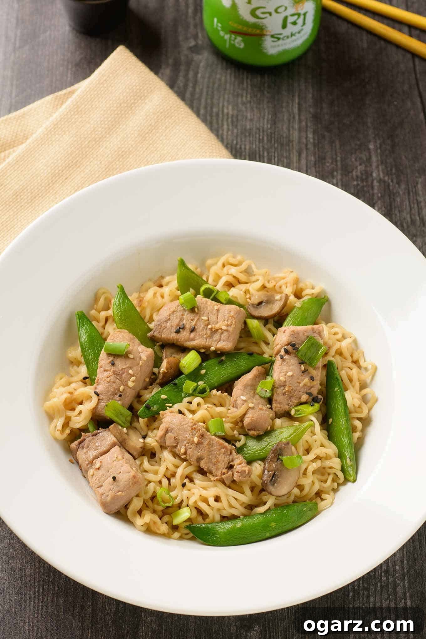 Pork Ramen Skillet Sensation 2 A shallow bowl of ramen noodles tossed with stir-fried pork, sugar snap peas, and scallions in soy-ginger sauce.