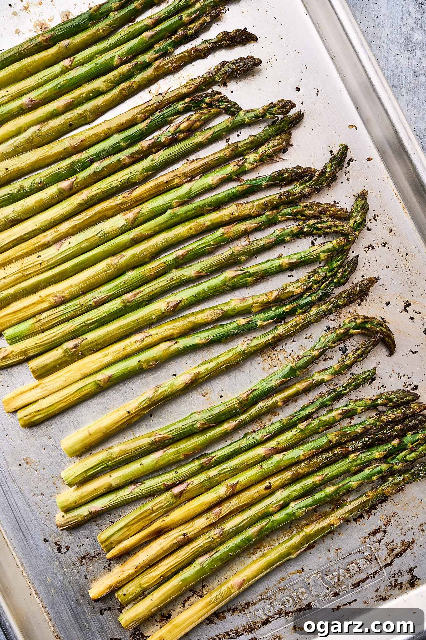 Zesty Roasted Asparagus 5 A baking sheet with asparagus spears roasted in butter.