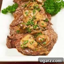 Medallions of filet mignon topped with sautéed mushrooms and a brandy cream sauce.