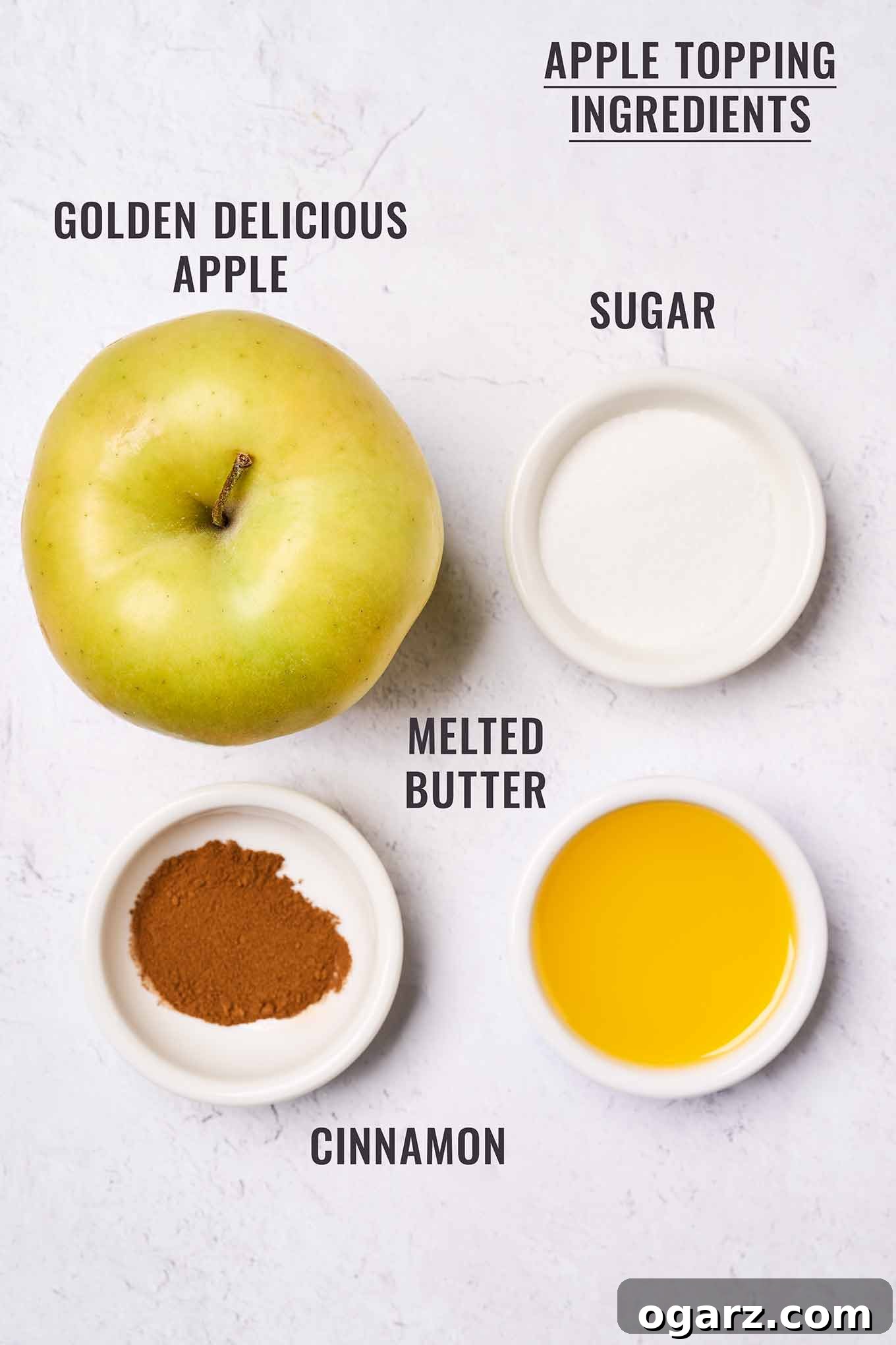 A labeled, overhead view of the topping ingredients for Golden Delicious apple cake; apple, melted butter, sugar, and cinnamon.