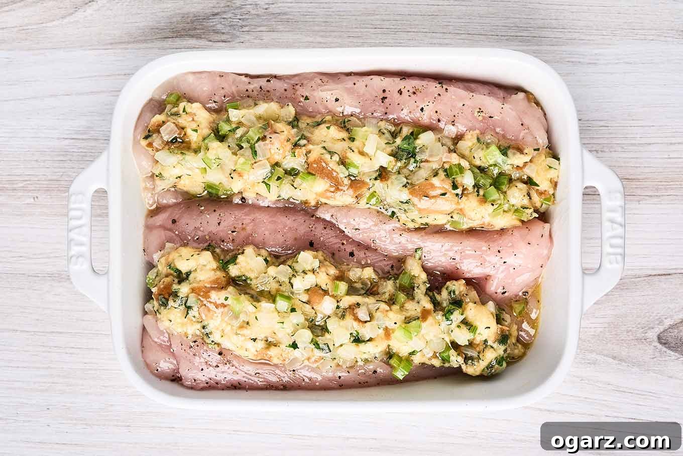 Succulent Baked Turkey Tenderloins with Savory Stuffing 7 Turkey tenderloins stuffed with homemade bread stuffing in a baking dish, ready for the oven.