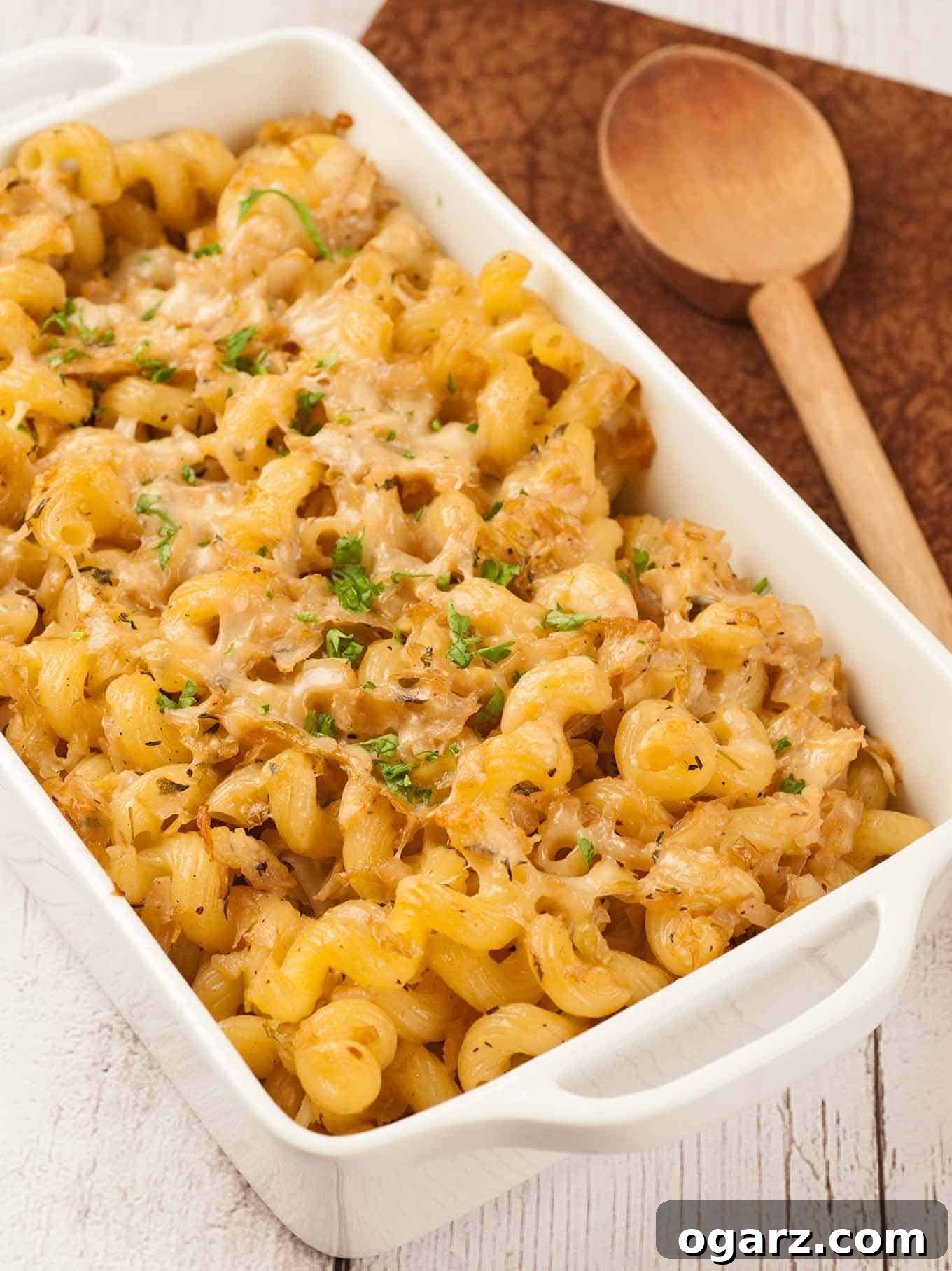 Thyme-Infused Cabbage Pasta with Parmesan 2 Baked cavatappi pasta with sautéed cabbage and fragrant thyme, topped with golden melted Parmesan cheese and a sprinkle of fresh parsley in a rustic white casserole dish. This savory side dish marries Italian influences with wholesome ingredients for a comforting meal.