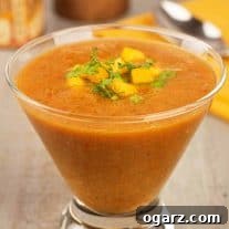 Close-up of Mango Gazpacho Soup with fresh garnishes