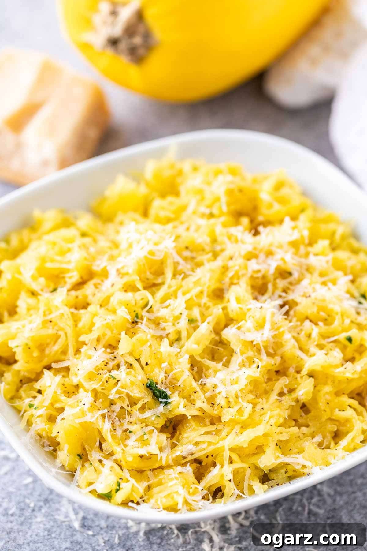 Perfectly Roasted Spaghetti Squash 2 Beautifully roasted spaghetti squash strands on a plate, ready to be served as a healthy meal.