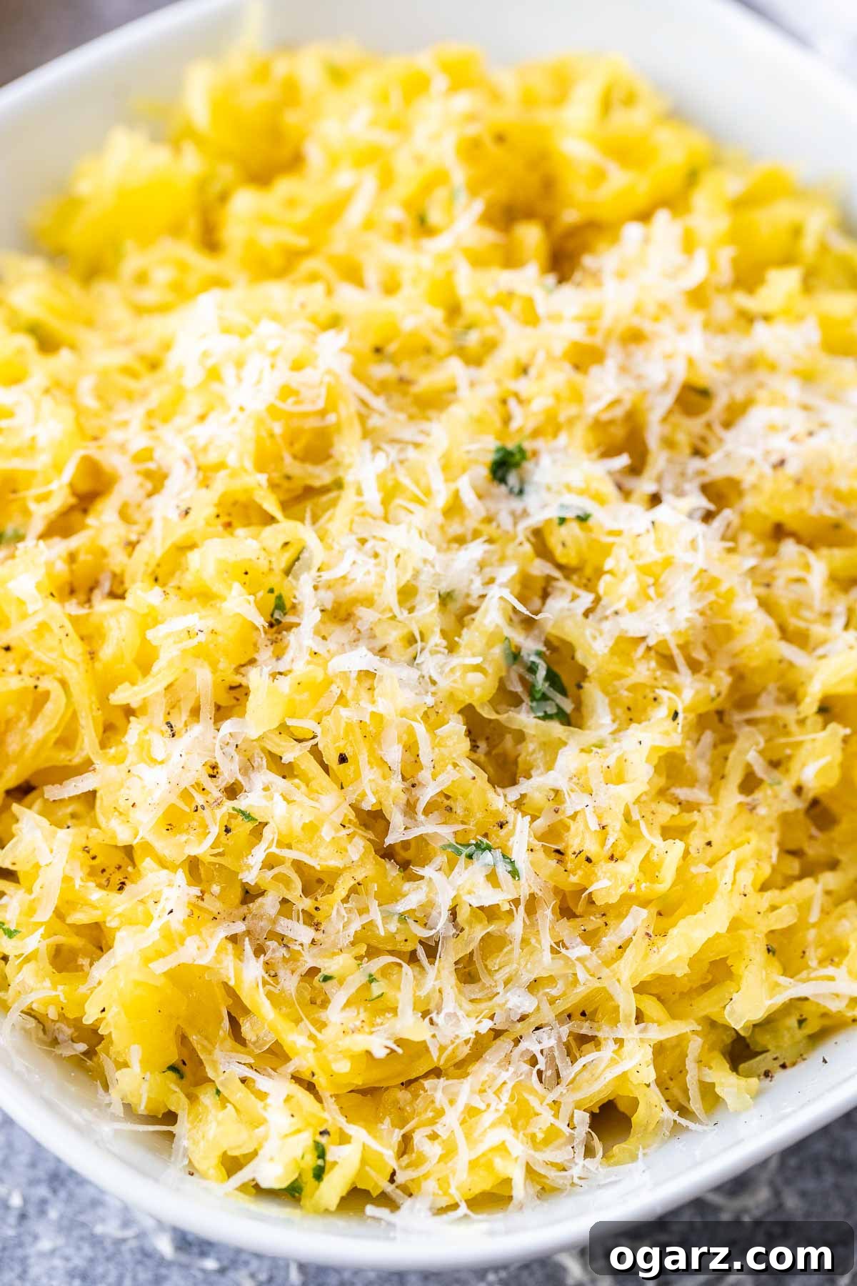 Perfectly Roasted Spaghetti Squash 4 A close-up view of perfectly roasted spaghetti squash strands, highlighting their firm, pasta-like texture.