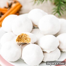 A charming display of traditional Pfeffernuesse cookies artfully arranged on a simple plate, ready to be enjoyed.