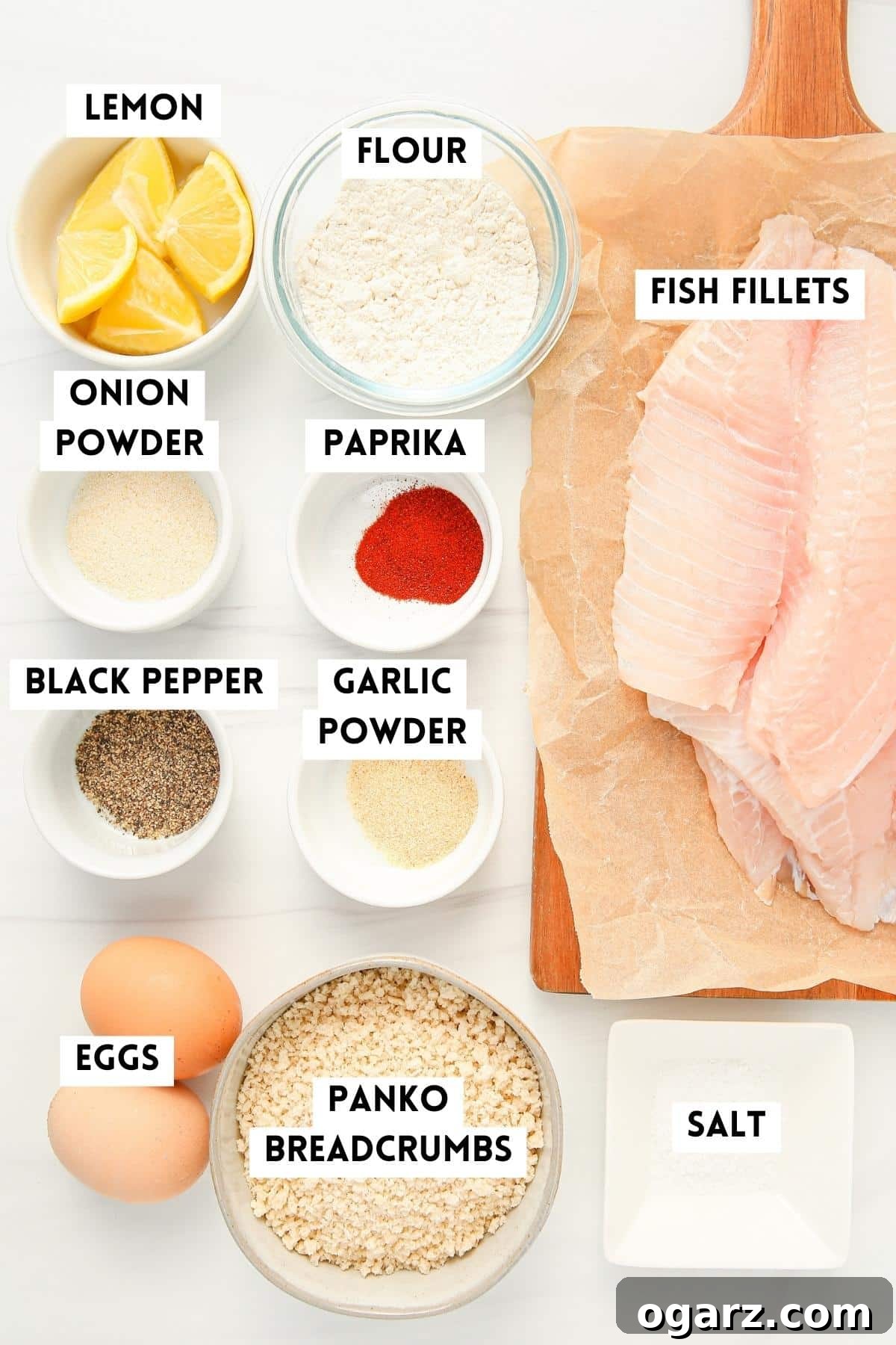 Golden Crispy Air Fryer Fish 3 ingredients for breaded tilapia.Lemon, Flour, Tilapia Filets, Onion Powder, Paprika, Black Pepper, Garlic Powder, Eggs, Panko Breacrumbs.