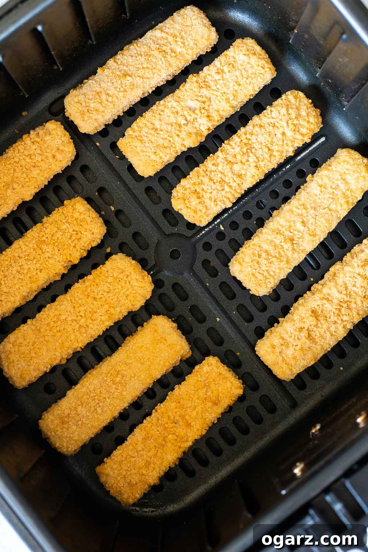 Crispy Air Fryer Fish Sticks 3 A basket of frozen fish sticks, ready for cooking in an Air Fryer.
