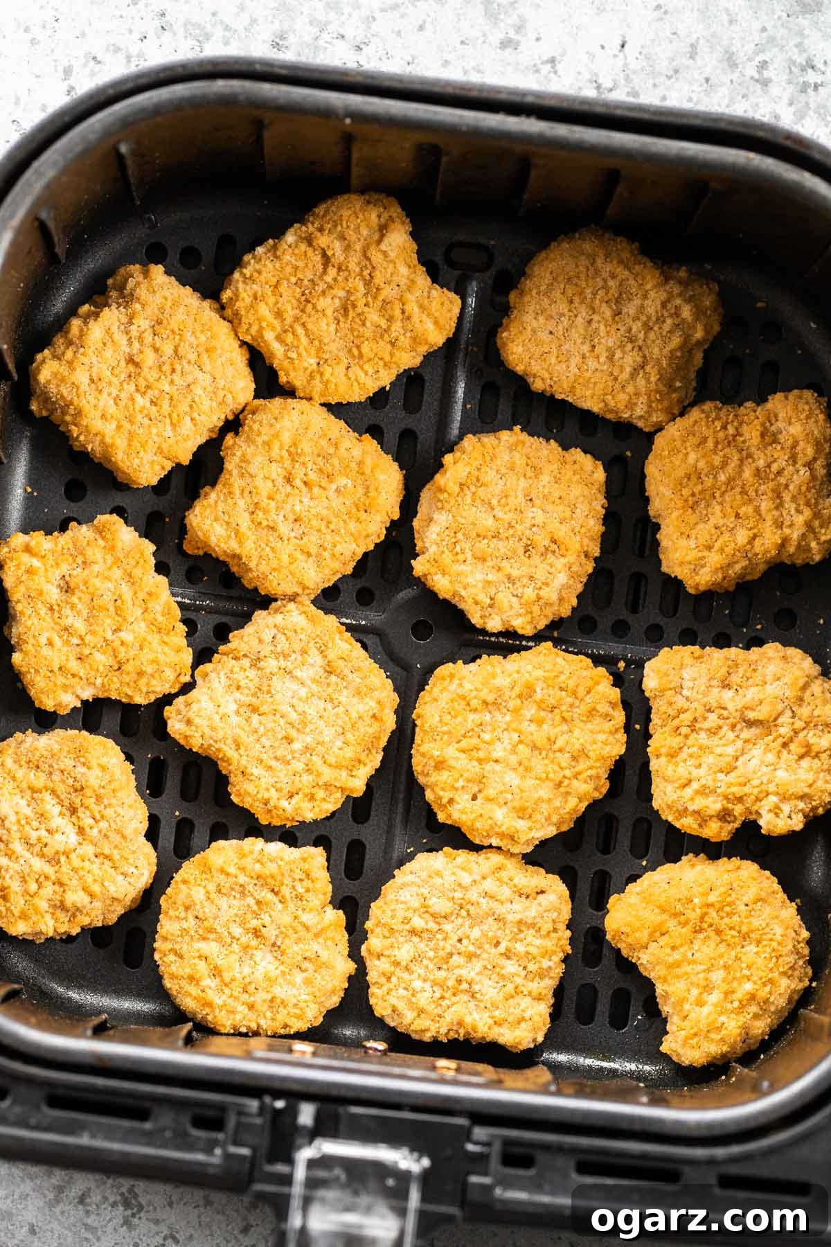 Mastering Crispy Air Fryer Frozen Chicken Nuggets 3 A basket full of frozen chicken nuggets, ready to be air-fried.