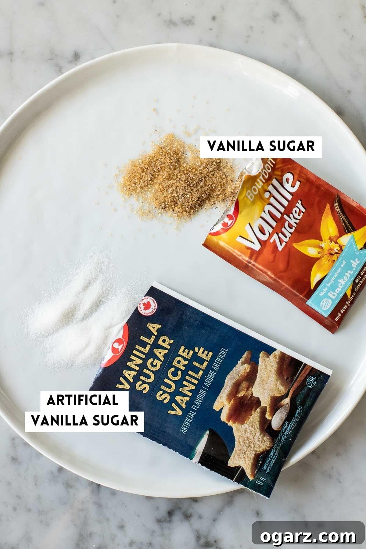 Two packages of store-bought vanilla sugar on a white plate.