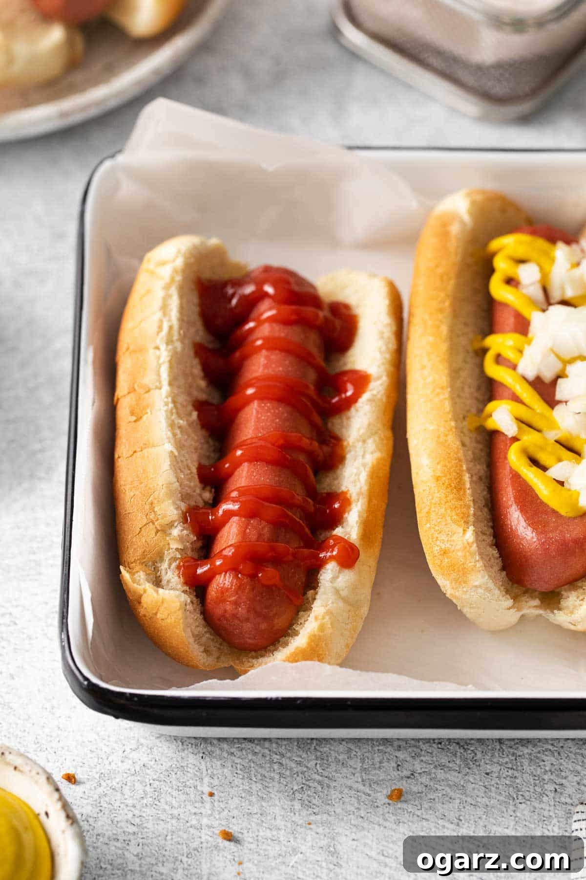 Golden Crispy Air Fryer Hot Dogs 5 A perfectly cooked air fryer hot dog garnished with a swirl of ketchup.