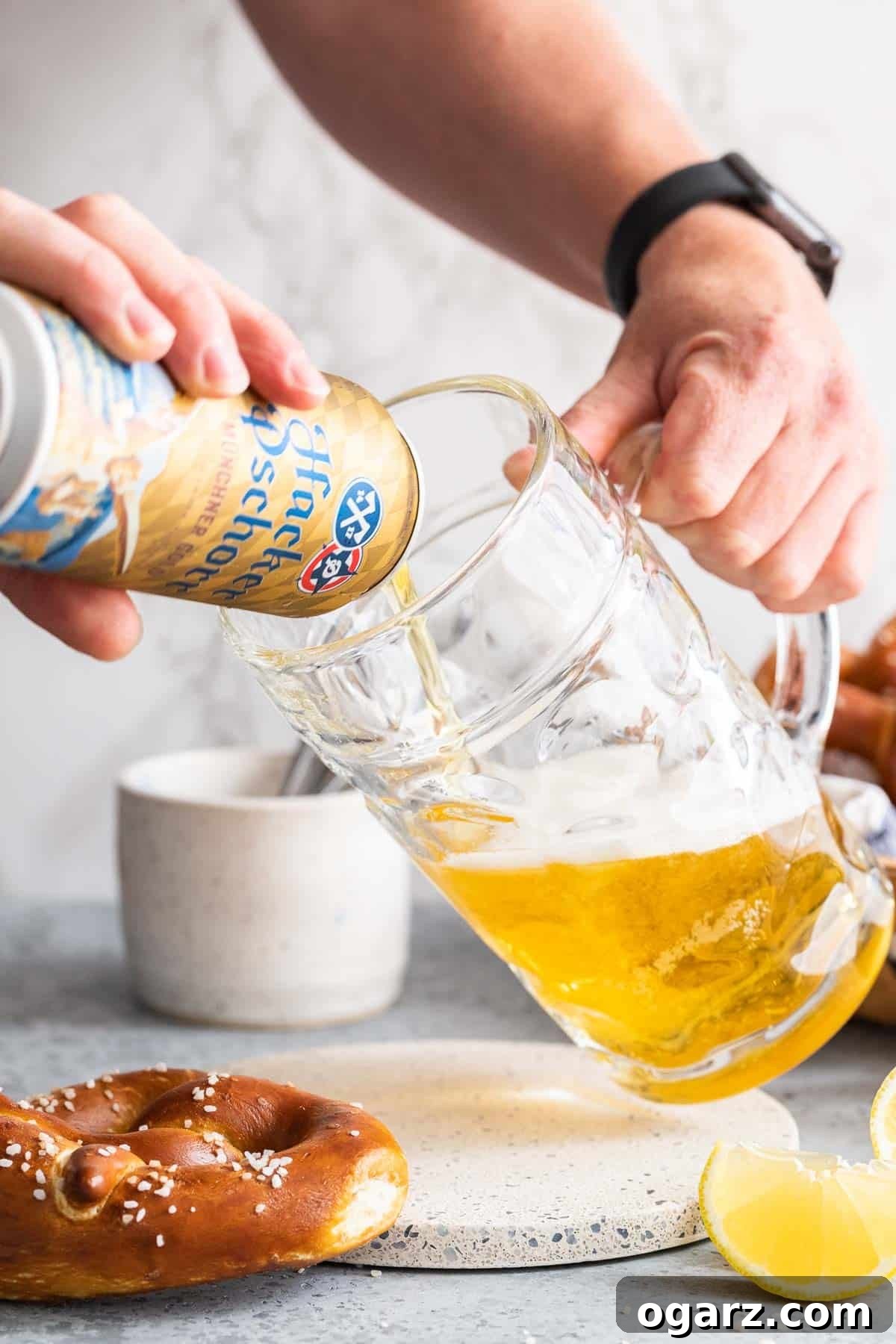 Zesty Lager Blend 4 Beer being expertly poured into a classic beer stein, the first step in making a Radler.