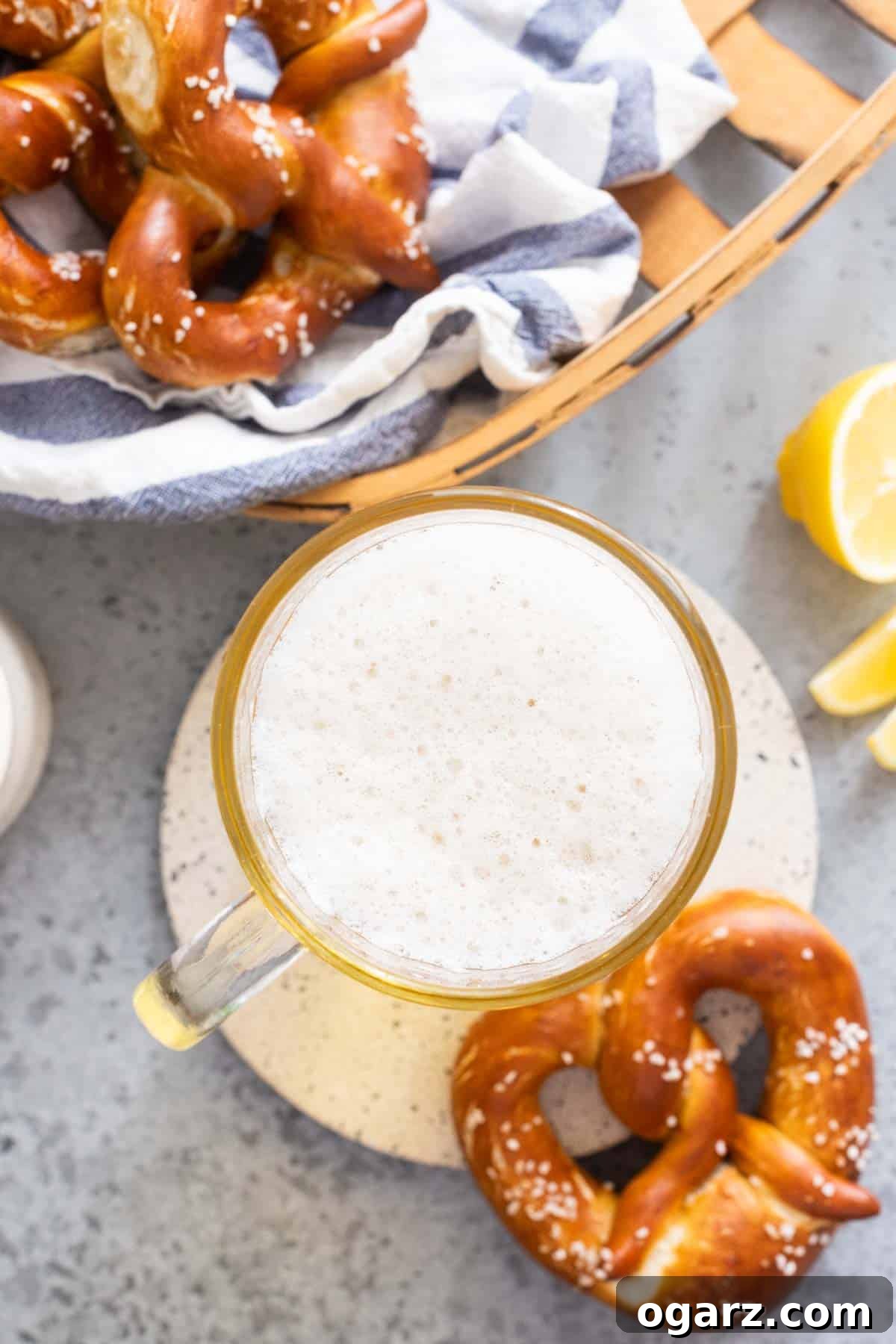 Zesty Lager Blend 8 A beer stein filled with Radler next to three pretzels, illustrating ideal food pairings.
