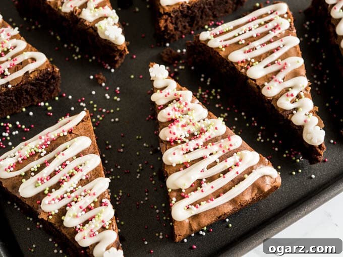 Festive Gingerbread Brownies 7 A top-down view of Gingerbread Christmas Brownies, with a few decorated with icing and sprinkles.