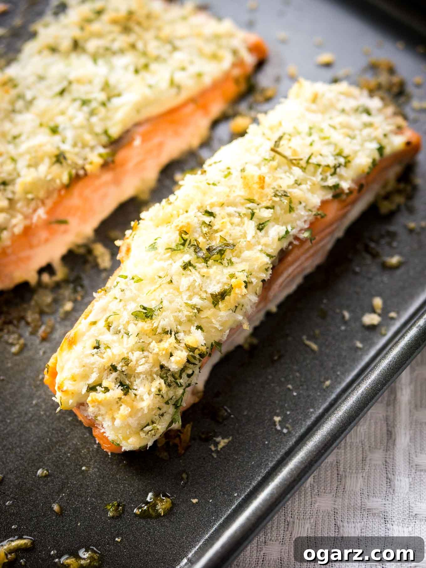 This Horseradish Parmesan crusted Salmon is baked in the oven and only takes 20 minutes to make. A dinner fancy enough for guests but also easy enough for weeknights!