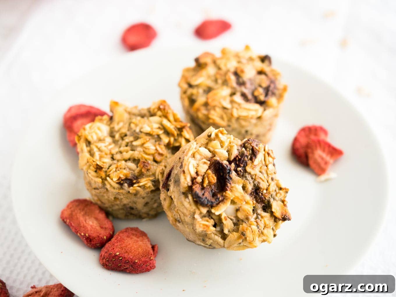 Healthy Strawberry Baked Oatmeal Cups 7 A beautiful spread of Strawberry Baked Oatmeal Cups, highlighting their appeal as a healthy, easy, and delicious breakfast option for meal prep.