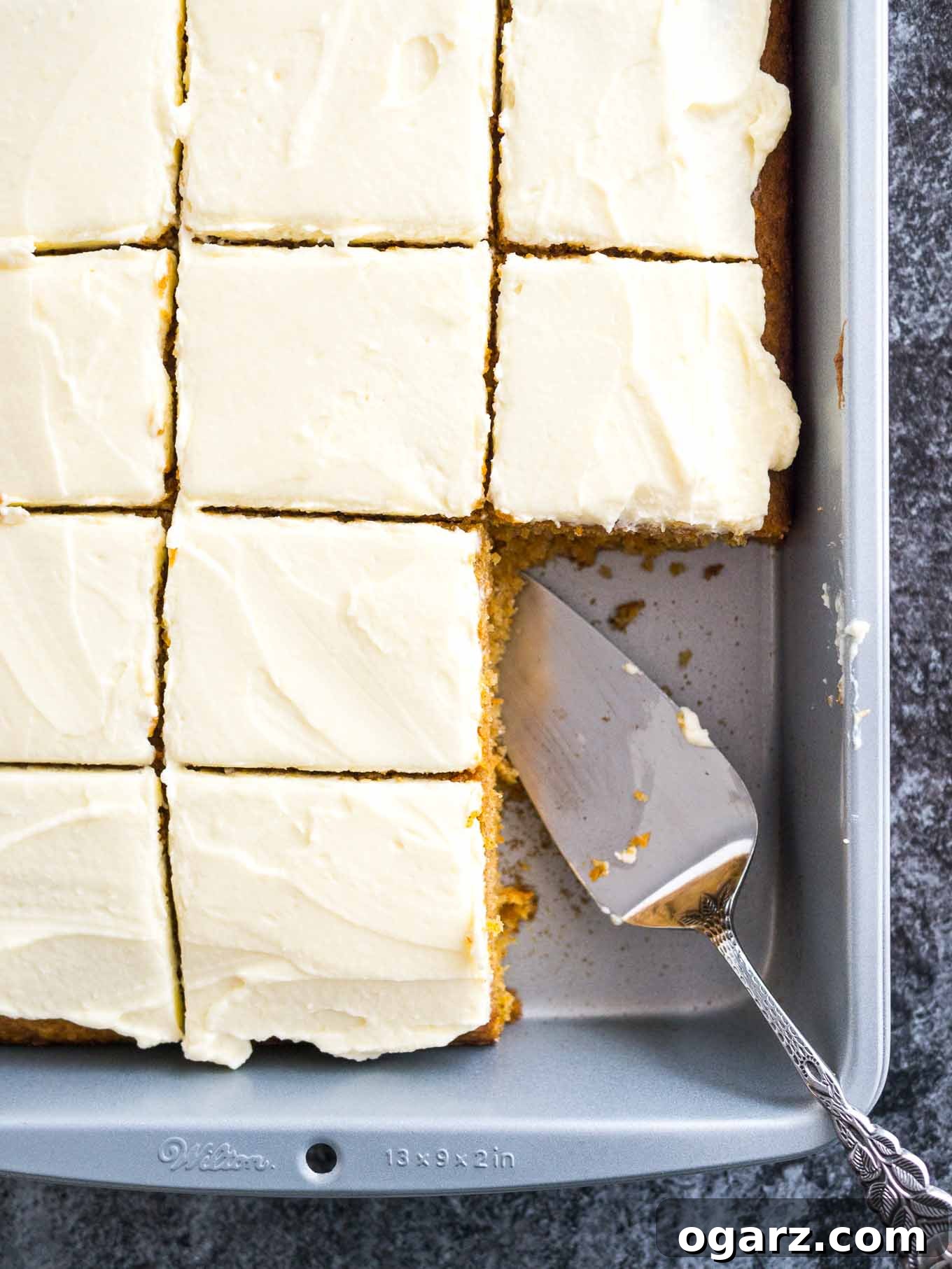 Effortless Carrot Cake Guide 3 A freshly baked carrot cake still in its baking pan, showing its golden-brown top, ready for frosting.