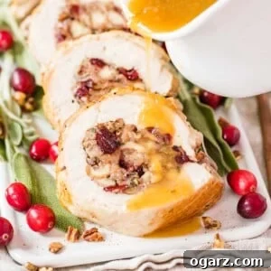 A sliced, stuffed turkey breast on a serving platter.