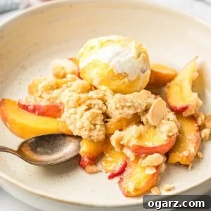 Peach crisp and ice cream on a plate