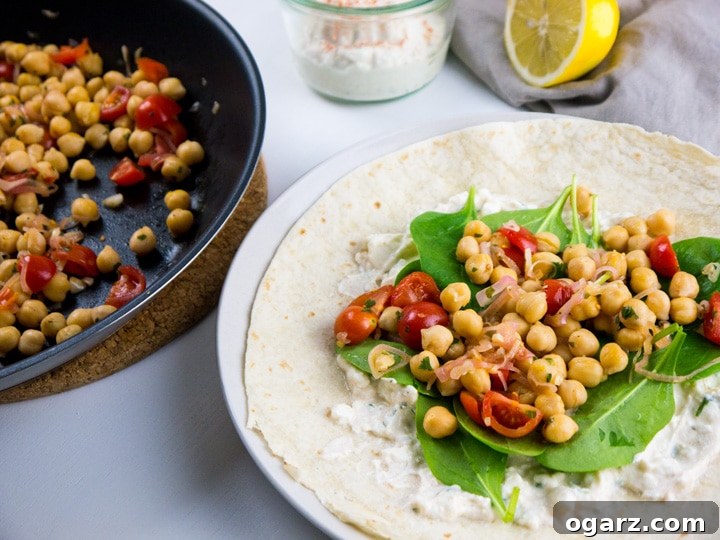 Vibrant Feta Spinach Chickpea Wrap 3 Spinach Wrap with Feta and Chickpeas makes the perfect midweek meal. The wraps are filled with feta spread, healthy chickpeas, and spinach. A great vegetarian dish which is ready in 15 minutes!