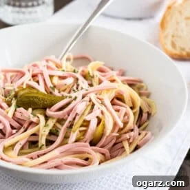 A bowl full of German Sausage Salad.
