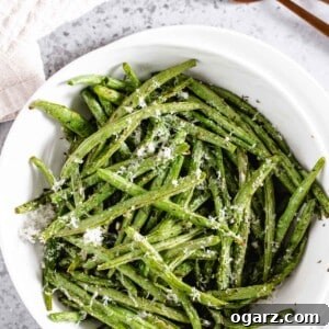 Above shot of perfectly cooked air fryer green beans with Parmesan cheese.