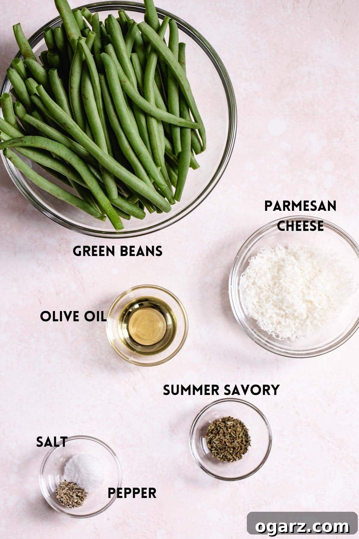 Crispy Air Fryer Green Beans 3 A flat lay image displaying fresh green beans, a bottle of olive oil, and various spices, representing the simple ingredients required for this recipe.