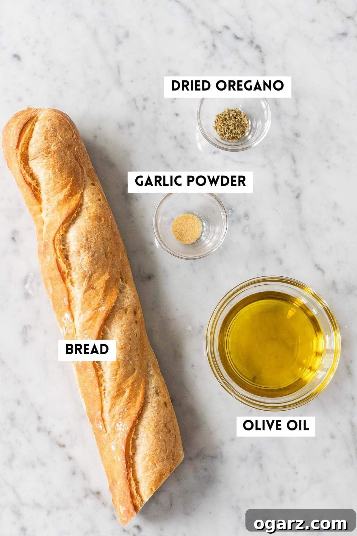 Crispy Air Fryer Croutons 3 A flat lay of ingredients needed for Air Fryer Croutons, including cubed bread, olive oil, and various spices.