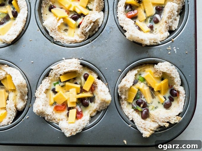 Mexican Fiesta Toast Bites 5 Four golden-brown Cheesy Mexican Toast Cups with a vibrant salsa topping, perfect for a sunny day brunch.