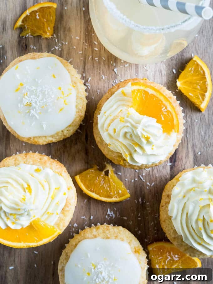 Nostalgic Orange Cream Cupcakes 4 Freshly grated orange zest and orange segments, highlighting the fresh ingredients used in these creamsicle cupcakes.
