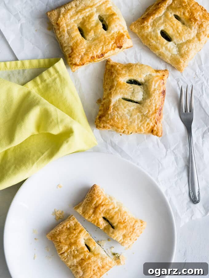 Spinach Ricotta Puff Pastry Pockets 4 Close-up shot of baked Spinach & Ricotta Puff Pastry Parcels, showing the golden crust and flaky layers.