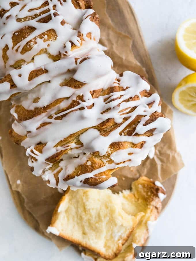 Sunshine Lemon Pull Apart Treat 4 Lemon Pull Apart Coffee Cake - A beautiful light and fluffy sweet bread, filled with lemon butter and topped with a tangy lemon glaze!