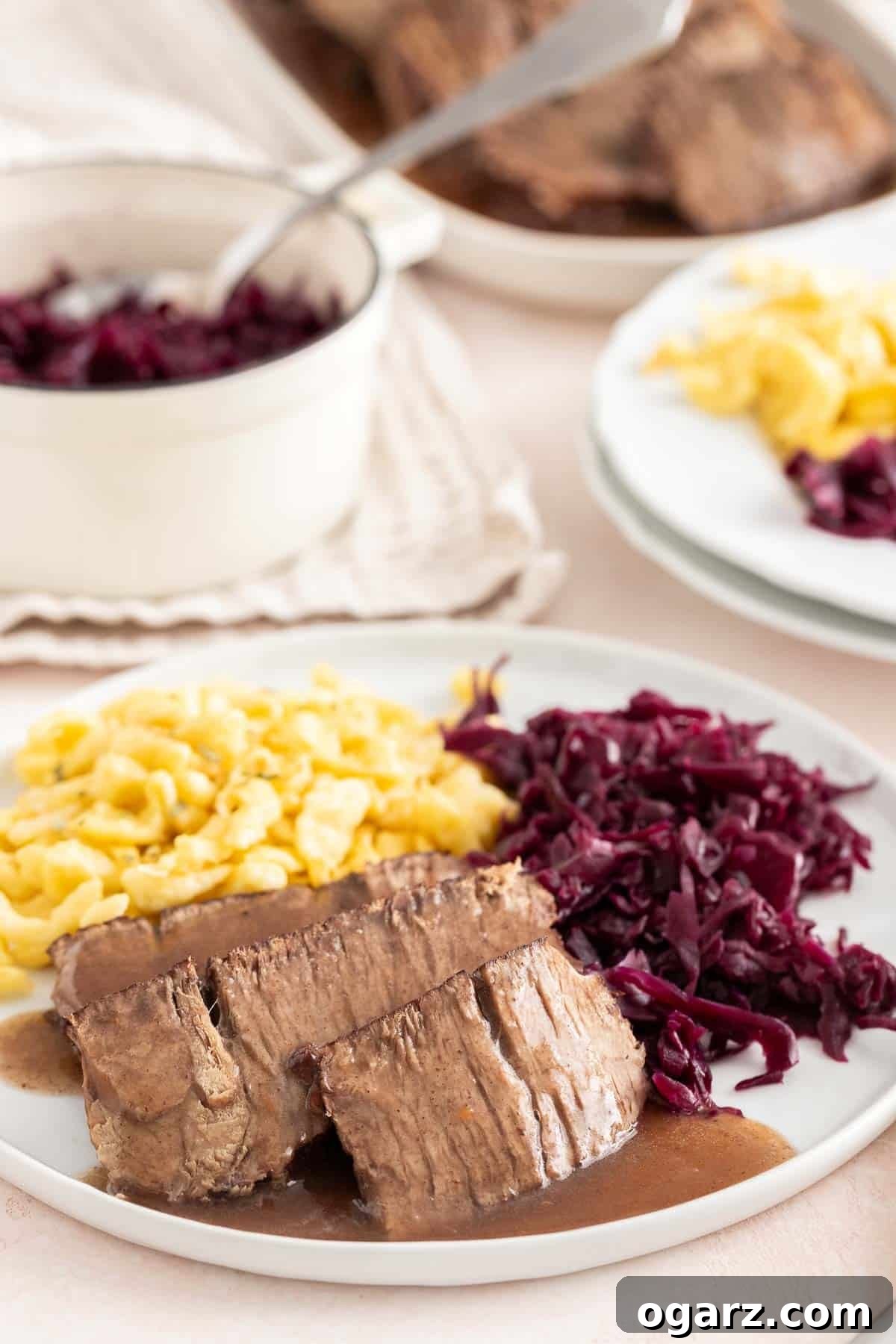 Tangy German Pot Roast 13 The finished roast served on a plate with sides.