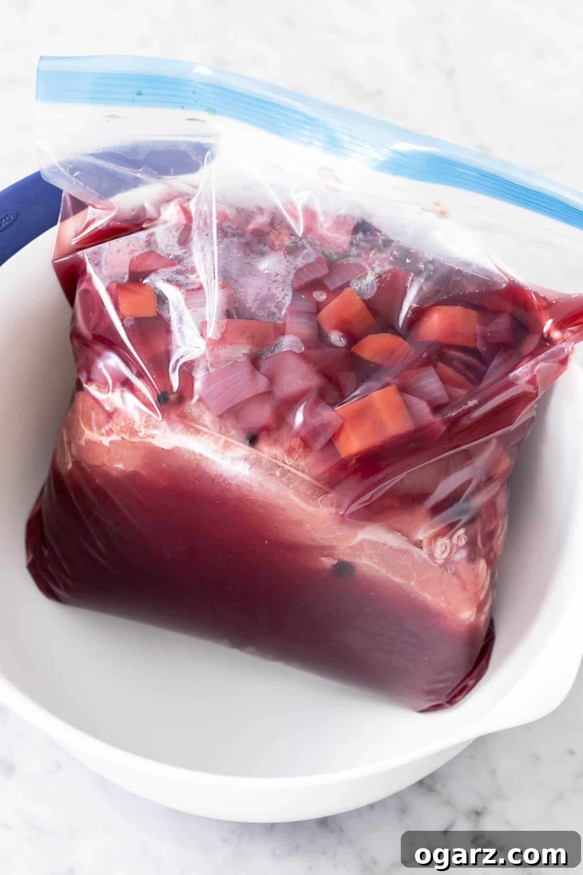 Tangy German Pot Roast 7 Roast and vegetables in brine in a plastic freezer bag.