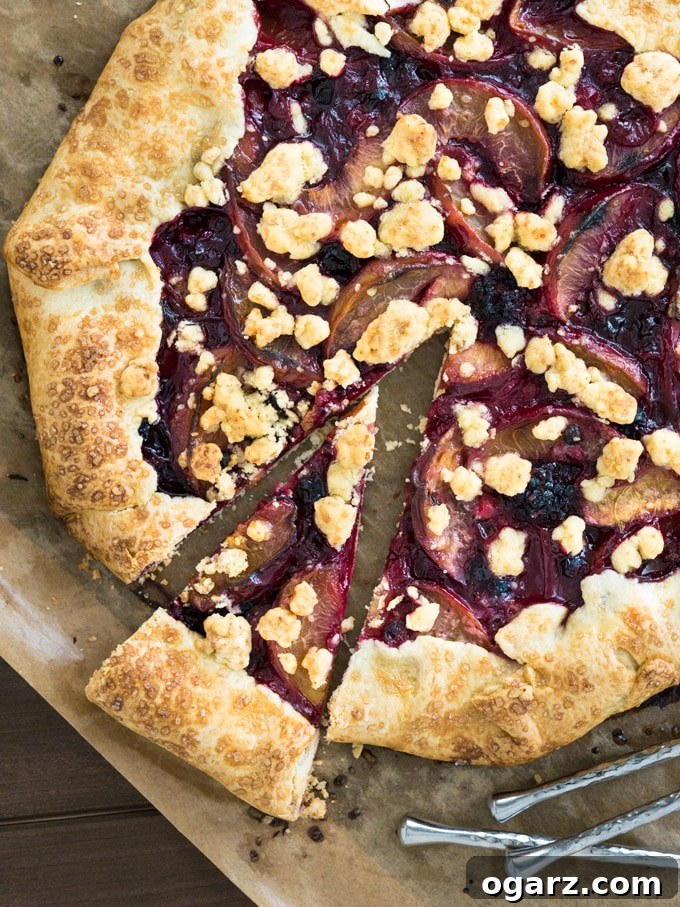 Close-up of the juicy peach and mixed berry filling prepared for the crostata, highlighting the fresh, colorful fruit pieces.