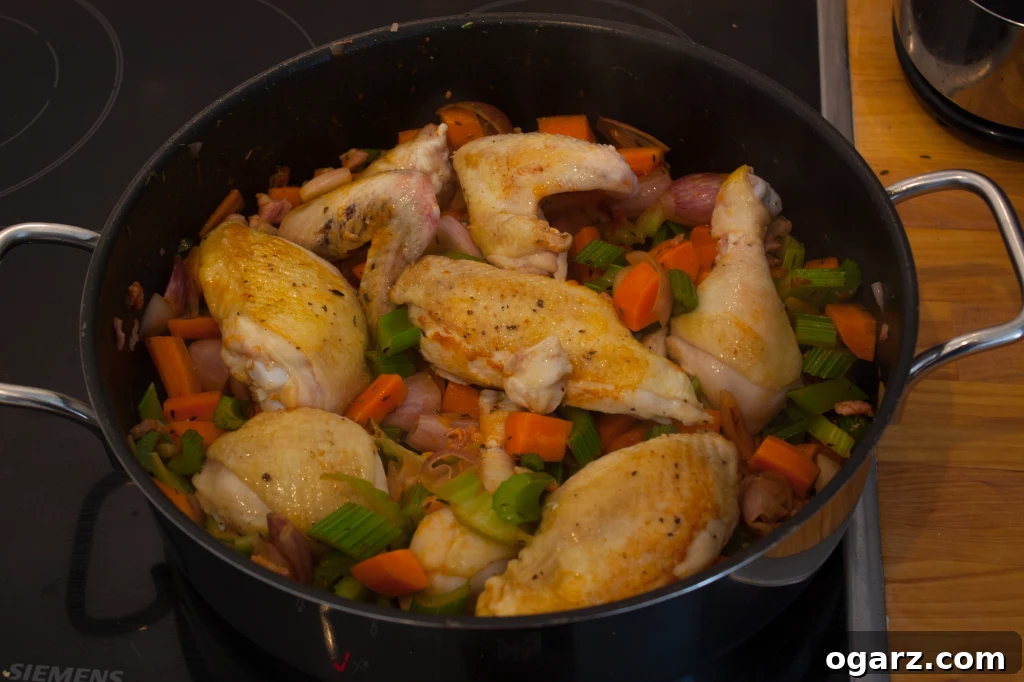 Effortless Coq au Vin Classic 5 Chicken and vegetables combined in a pot with red wine for braising