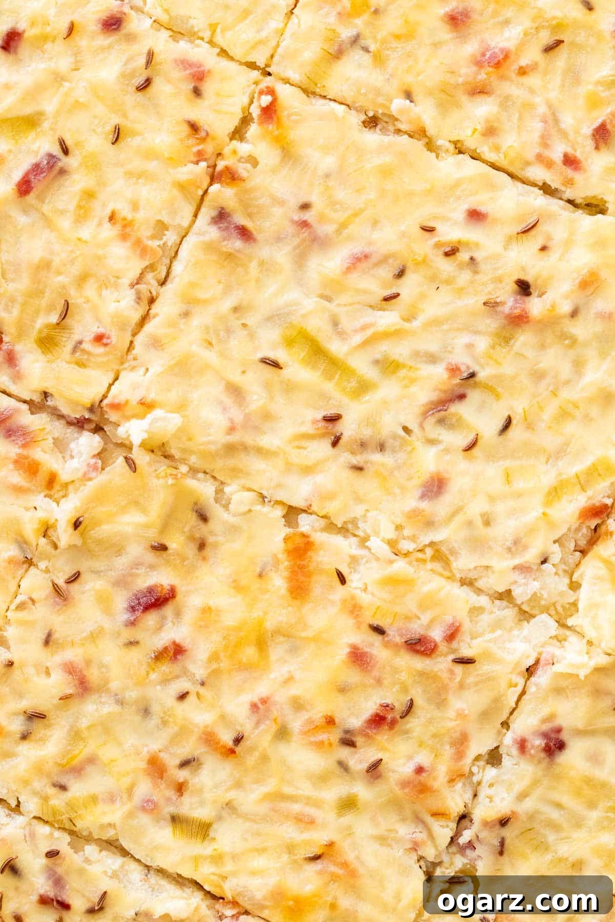 A close-up of the freshly baked German Onion Pie, golden and inviting.