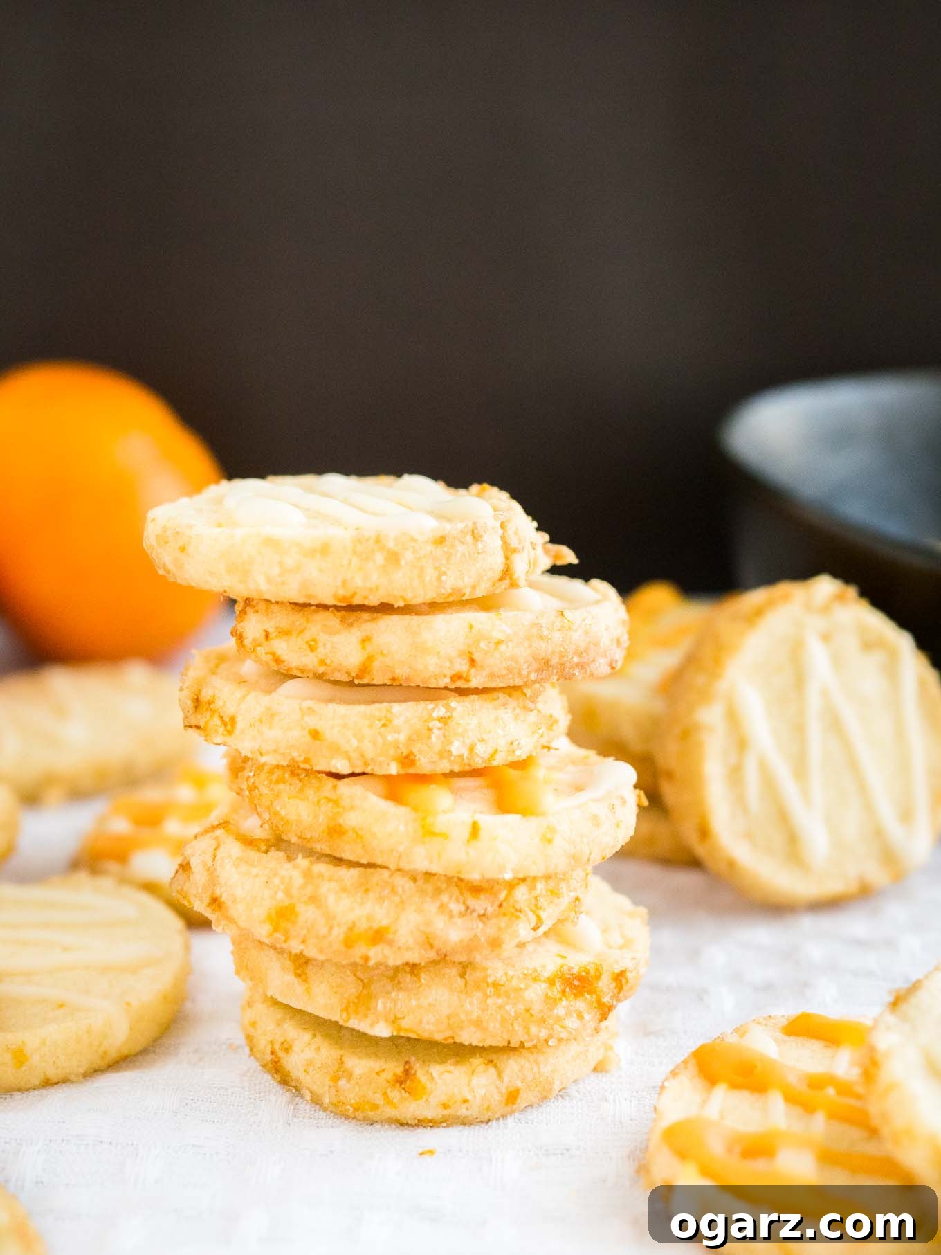 Batch of Slice & Bake Orange Almond Cookies on a cooling rack, showing their golden hue