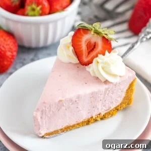 A slice of No-Bake Strawberry Cheesecake on a white plate