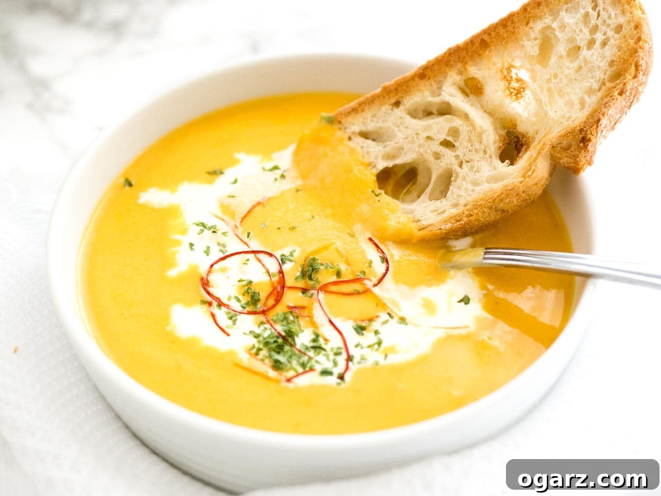 Creamy Instant Pot Carrot Soup 9 Pin-worthy image: A vibrant Instant Pot Carrot Soup in a rustic bowl, garnished with fresh cilantro and a swirl of cream. Text overlays emphasize 'Pressure Cooker Carrot Soup,' 'Carrot Coconut Soup,' 'Easy Carrot Soup,' 'Easy Instant Pot Recipe,' and 'Spicy and Sweet Carrot Soup' for SEO.