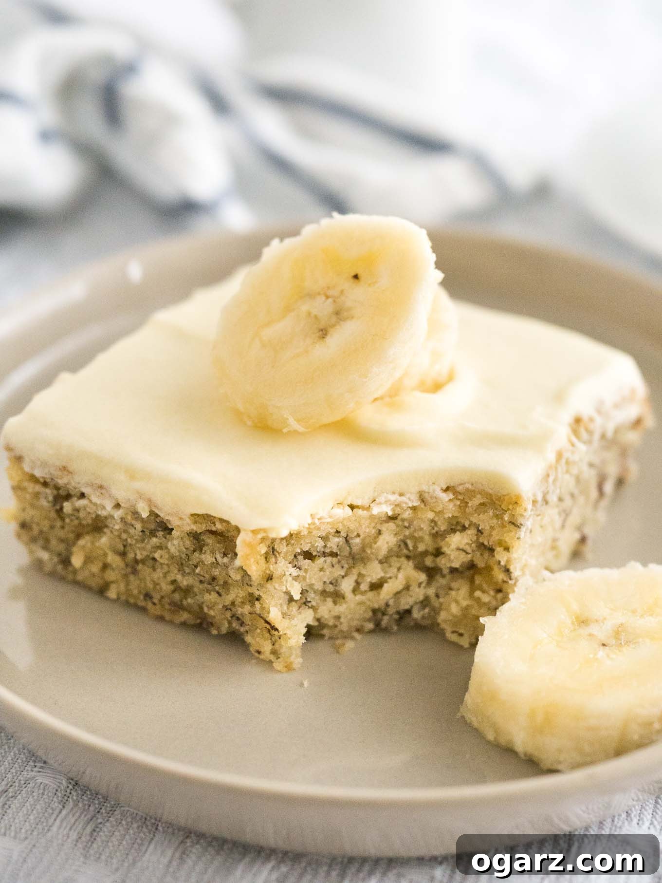 Easy Banana Cake - this fluffy and moist sheet cake has a mascarpone frosting on top and is ready in under 30 mins! A perfect cake to use overripe bananas.