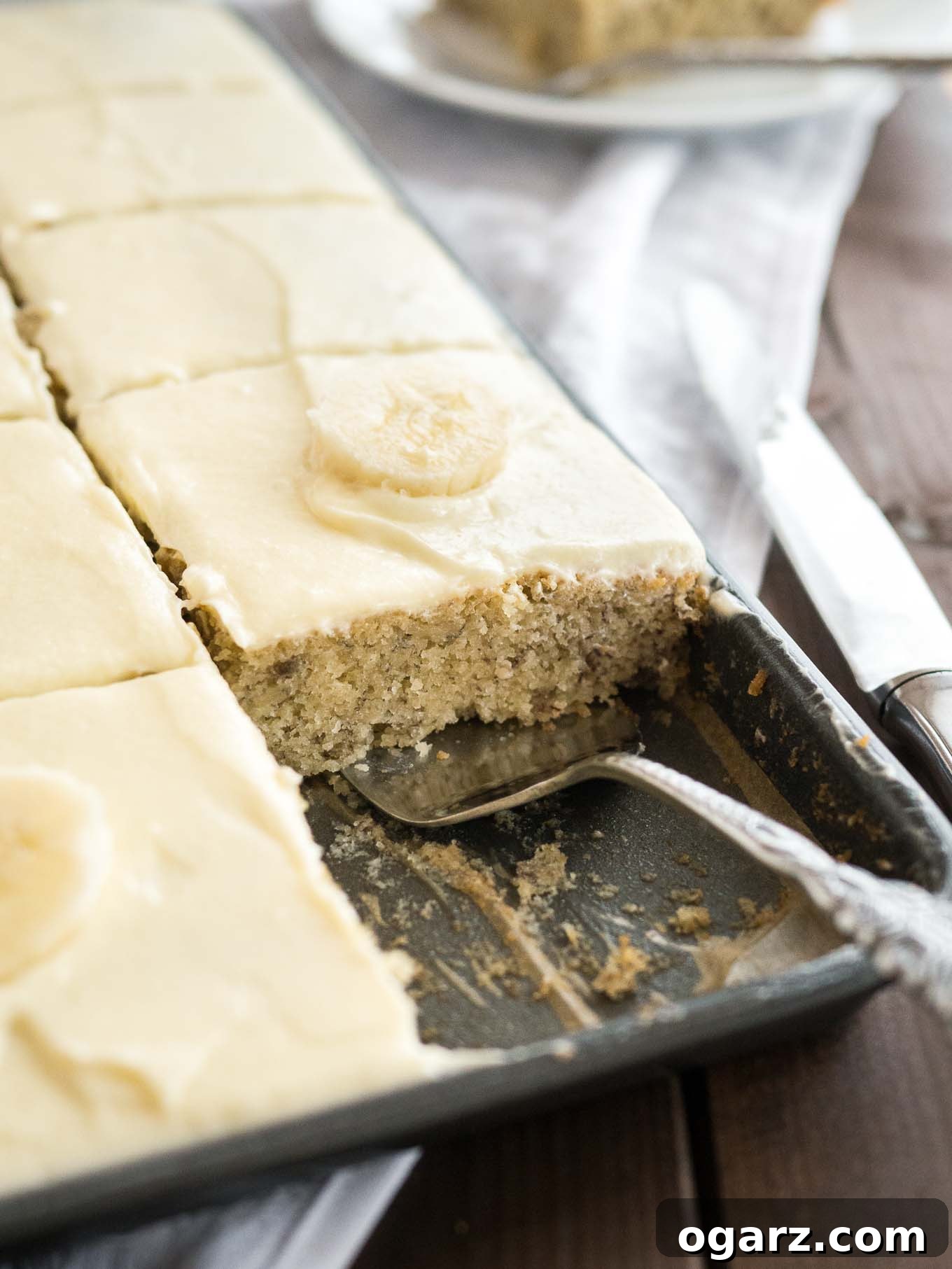 Easy Banana Cake - this fluffy and moist sheet cake has a mascarpone frosting on top and is ready in under 30 mins! A perfect cake to use overripe bananas.