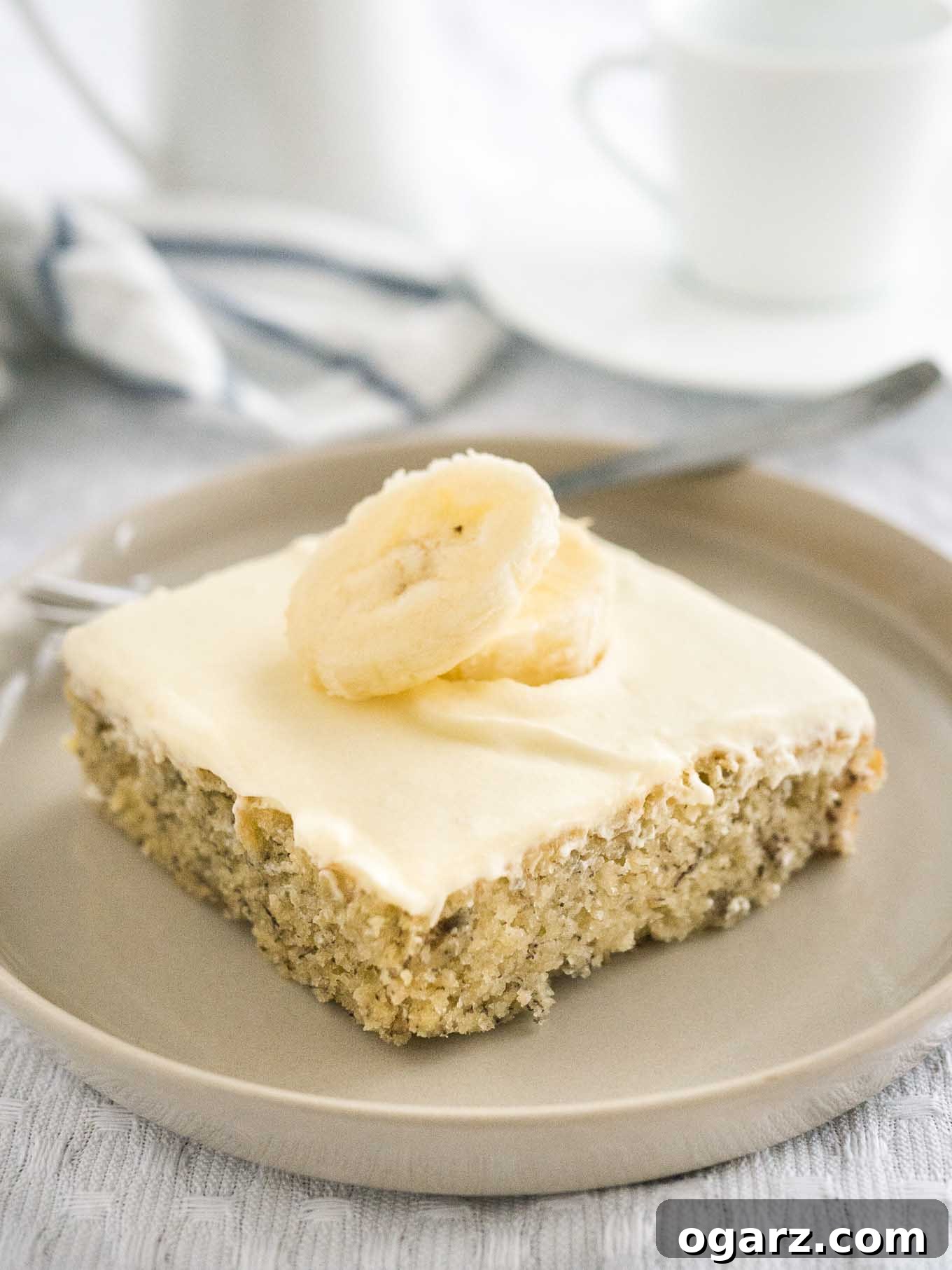 Easy Banana Cake - this fluffy and moist sheet cake has a mascarpone frosting on top and is ready in under 30 mins! A perfect cake to use overripe bananas.